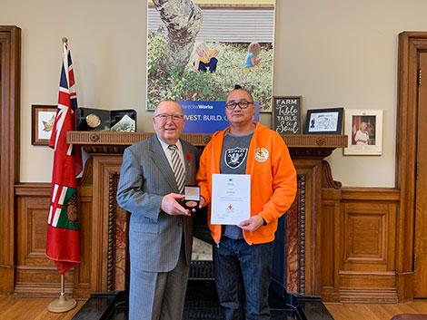 Photo of Honourable Ralph Eichler,  Minister of Economic Development and Training; and Elvis MacKay, Manitoba Recipient of the 2019 COF Literacy Award