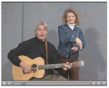 Aaron and Kimberley Burnett singing and signing Get off the Couch