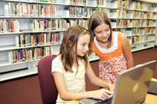 Two girls in library